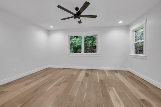 unfurnished room featuring light wood-style floors, recessed lighting, ceiling fan, and baseboards