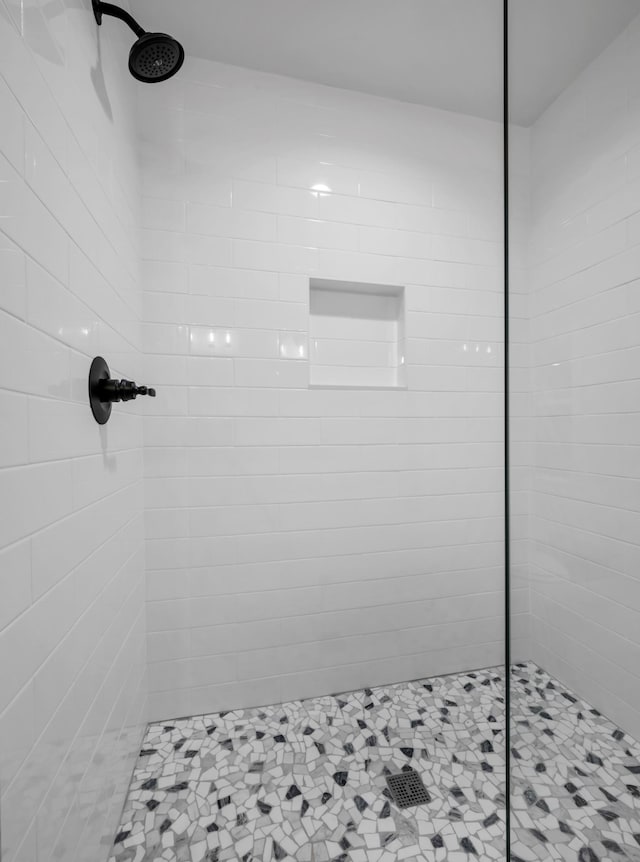 bathroom with tiled shower