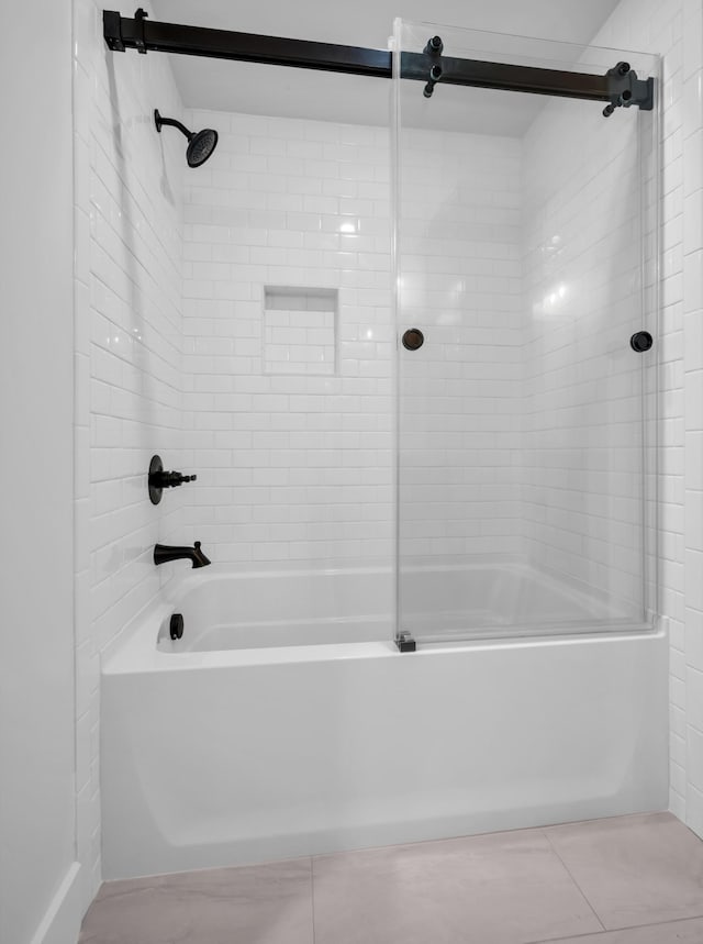 bathroom featuring tile patterned flooring and bathtub / shower combination