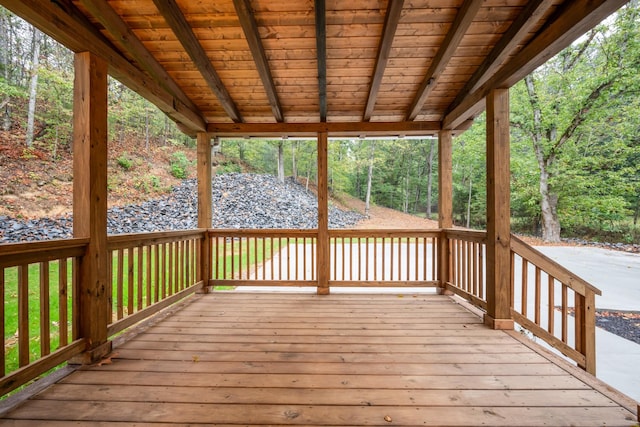 wooden deck featuring a view of trees