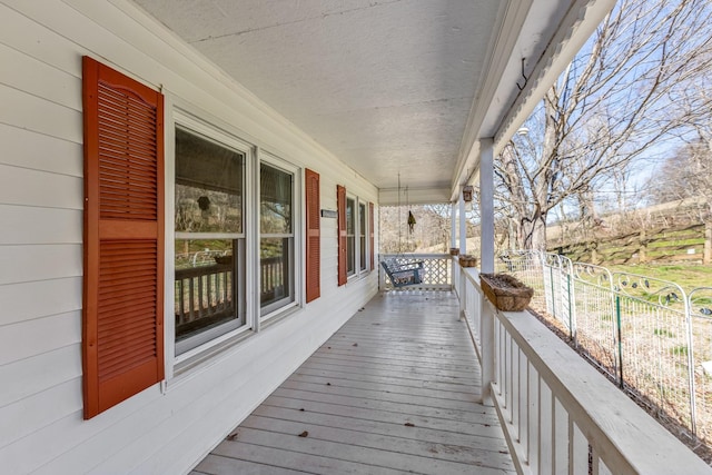 wooden terrace with a porch