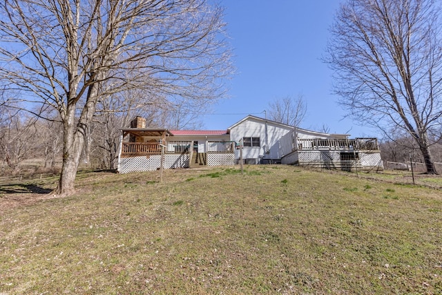 view of yard with a wooden deck