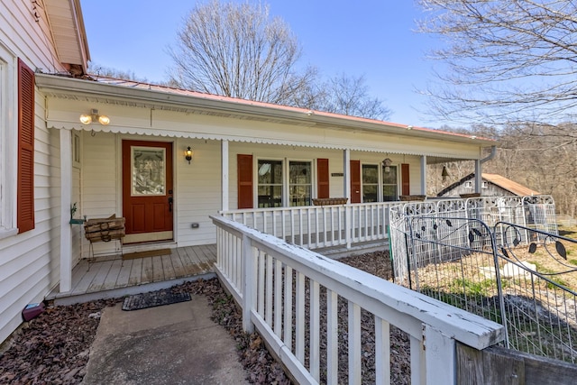 doorway to property featuring covered porch