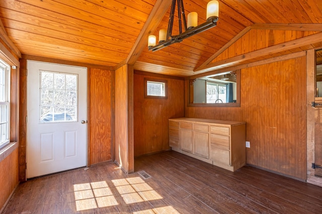 interior space featuring wood walls, wood ceiling, vaulted ceiling, and dark wood-style flooring