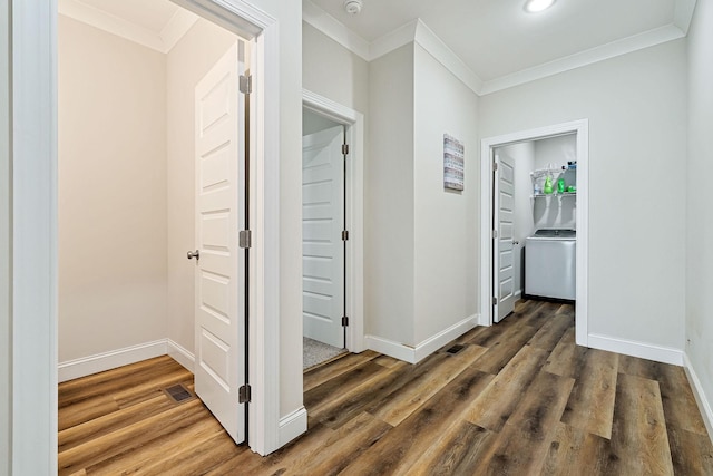 corridor featuring ornamental molding, wood finished floors, and baseboards