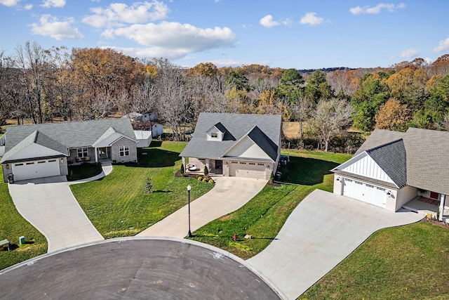 birds eye view of property with a forest view