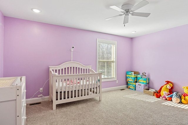 carpeted bedroom featuring baseboards, visible vents, a ceiling fan, and recessed lighting