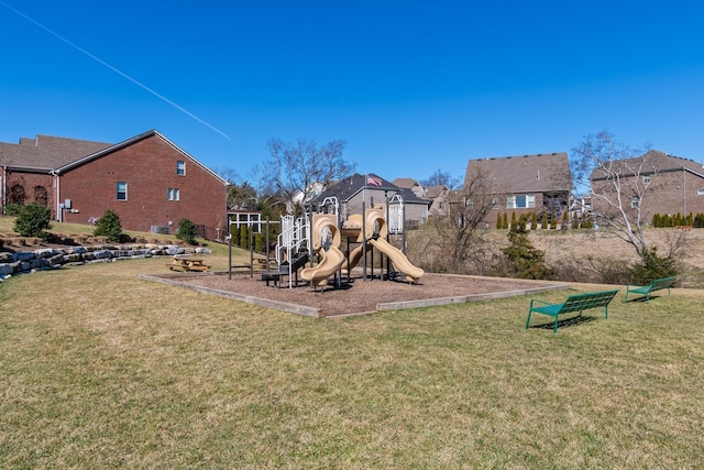 community playground with a yard and a residential view