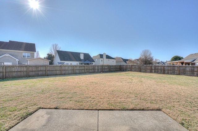 view of yard with a fenced backyard