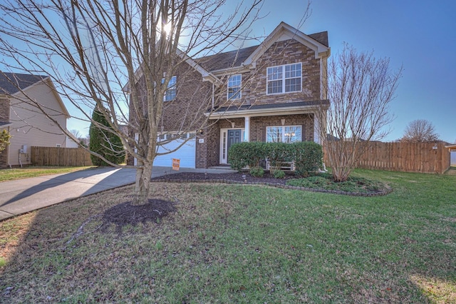 traditional-style home with brick siding, concrete driveway, fence, a garage, and a front lawn