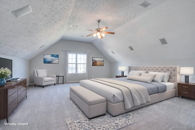 bedroom featuring vaulted ceiling, carpet floors, a textured ceiling, and visible vents