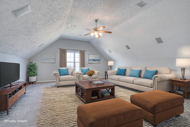 carpeted living room with lofted ceiling, a textured ceiling, visible vents, and baseboards