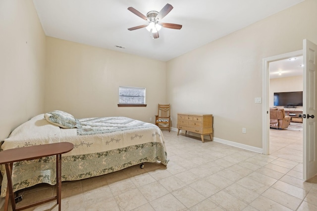 bedroom featuring ceiling fan, visible vents, and baseboards