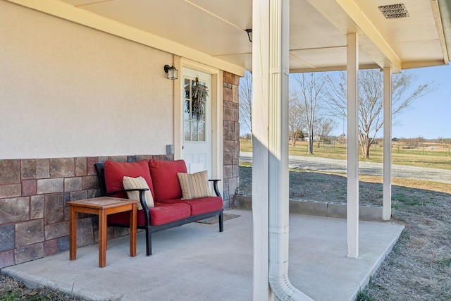 view of patio with a porch and visible vents