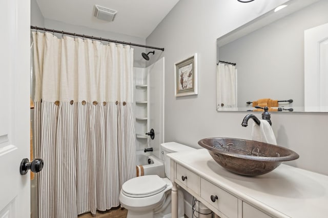 full bath featuring toilet, vanity, visible vents, and shower / tub combo with curtain