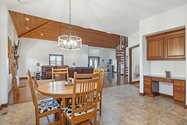 dining area featuring stairs, built in desk, wooden ceiling, and visible vents