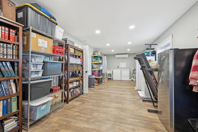 storage featuring separate washer and dryer and a wall mounted AC