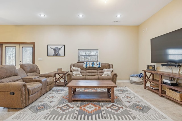 living area with recessed lighting, french doors, visible vents, and baseboards