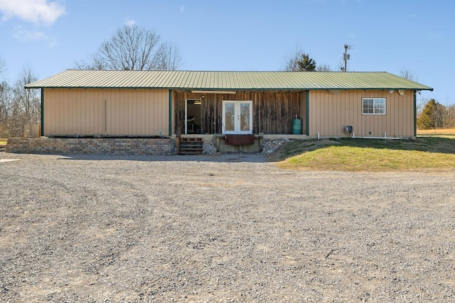 view of front of property with french doors and metal roof