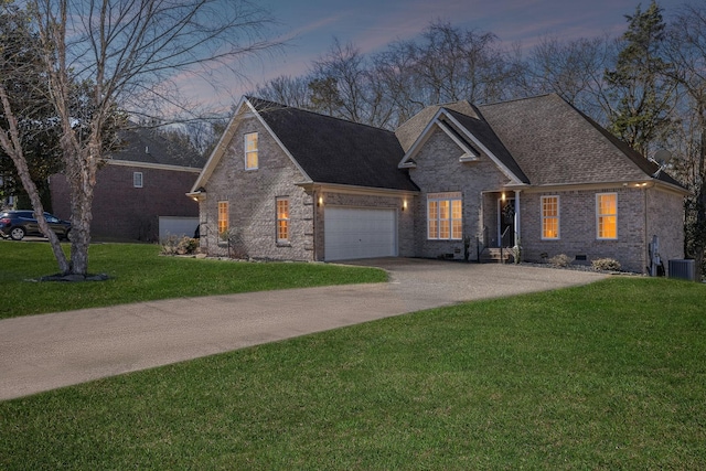 traditional home featuring central AC, brick siding, driveway, crawl space, and a front yard