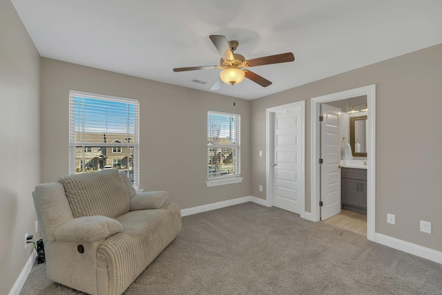 sitting room with light carpet, visible vents, and baseboards