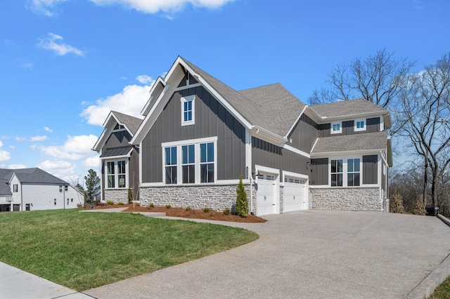 craftsman-style home featuring stone siding, board and batten siding, driveway, and a front yard