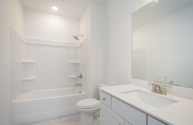 bathroom featuring  shower combination, vanity, and toilet