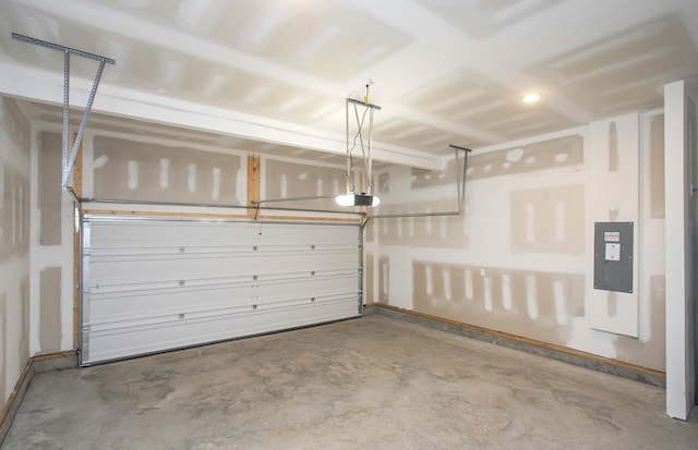 garage featuring a garage door opener and electric panel