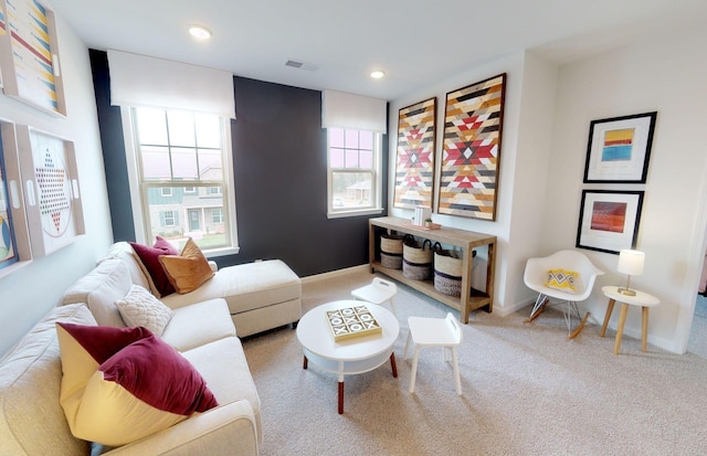 carpeted living room with recessed lighting, visible vents, and baseboards