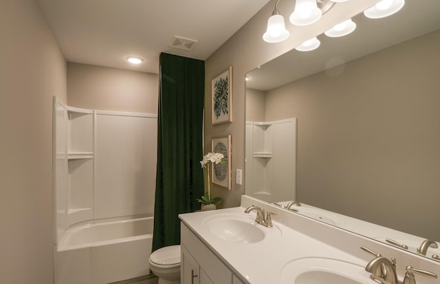 bathroom featuring visible vents, a sink, and toilet