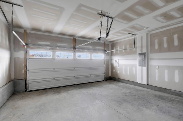 garage with electric panel and a garage door opener