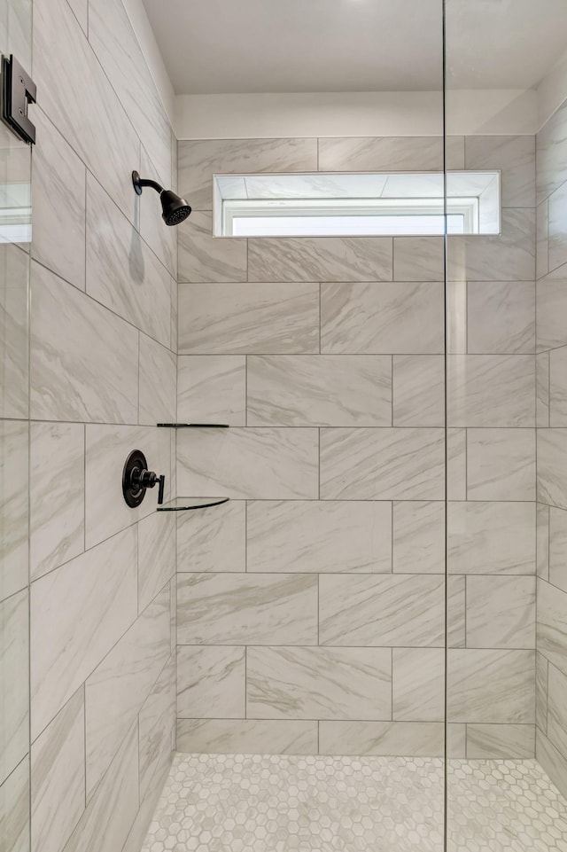 bathroom featuring tiled shower