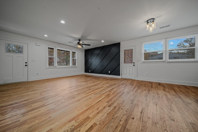 unfurnished living room featuring light wood-style flooring, recessed lighting, visible vents, and baseboards