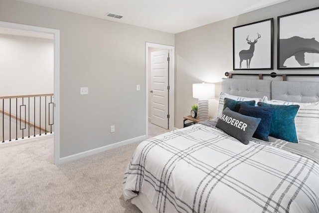 bedroom with carpet flooring, visible vents, and baseboards