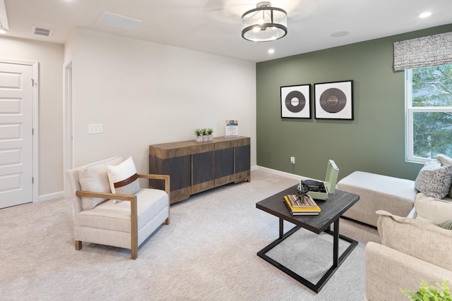 living room featuring recessed lighting, carpet flooring, visible vents, and baseboards