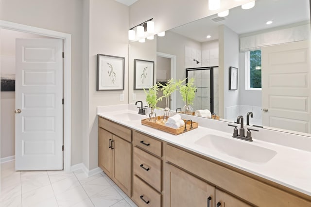 bathroom featuring a stall shower, visible vents, marble finish floor, and a sink