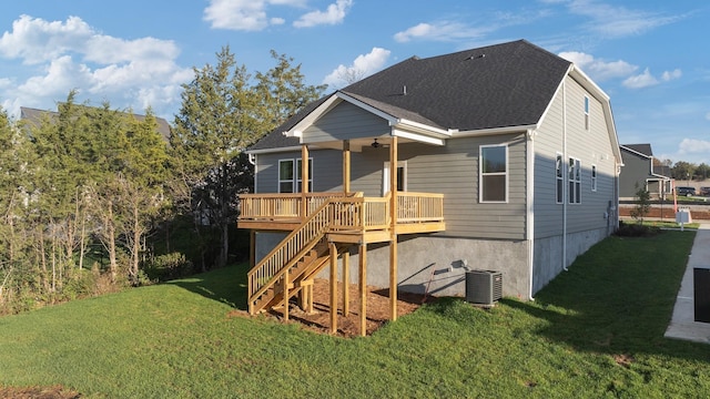 back of house with central AC unit, a lawn, roof with shingles, stairs, and a deck