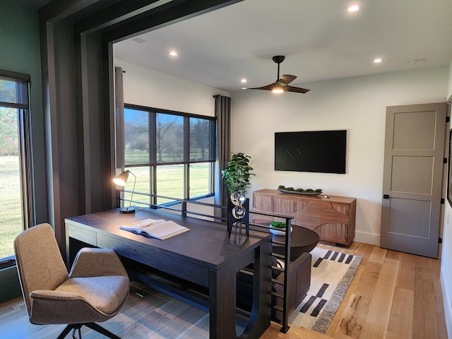 home office featuring plenty of natural light, light wood-type flooring, a ceiling fan, and recessed lighting