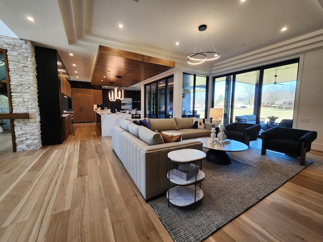 living room with recessed lighting and light wood finished floors