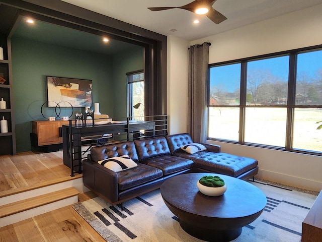 living room featuring ceiling fan, plenty of natural light, light wood-style flooring, and recessed lighting