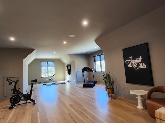 workout room featuring recessed lighting and light wood-style floors