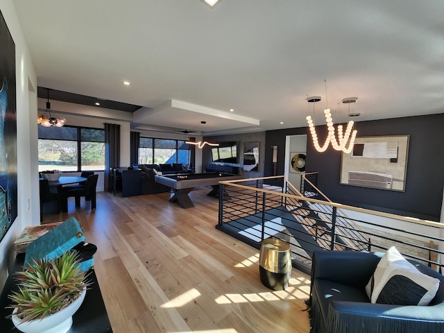 interior space featuring an inviting chandelier, light wood-style flooring, and recessed lighting