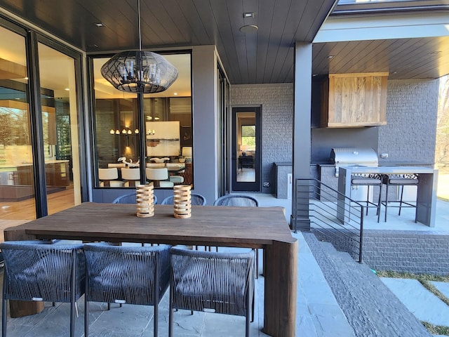 view of patio / terrace with area for grilling and outdoor dining space