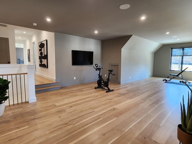 exercise room with light wood-type flooring, visible vents, and recessed lighting