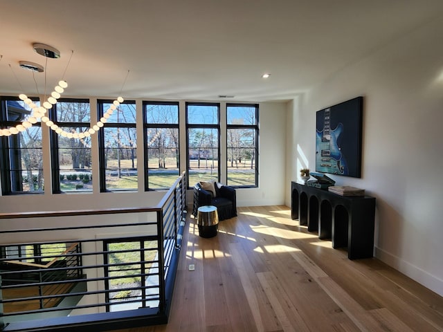 interior space with wood-type flooring and baseboards