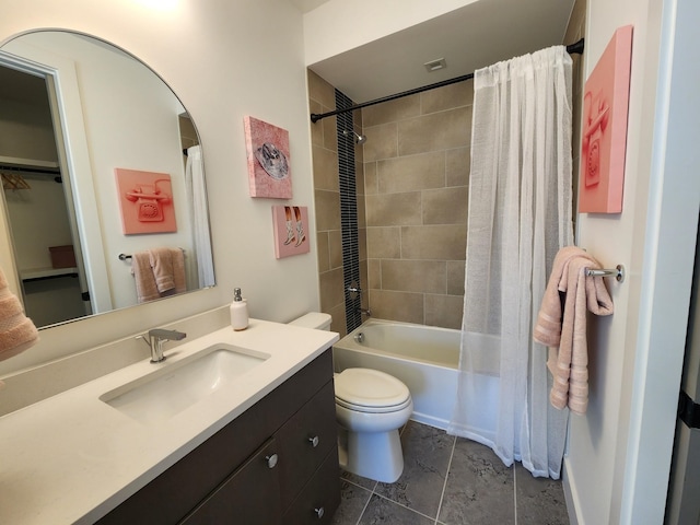 bathroom with shower / bathtub combination with curtain, vanity, and toilet