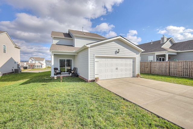 view of front facade featuring driveway, central AC unit, an attached garage, fence, and a front yard