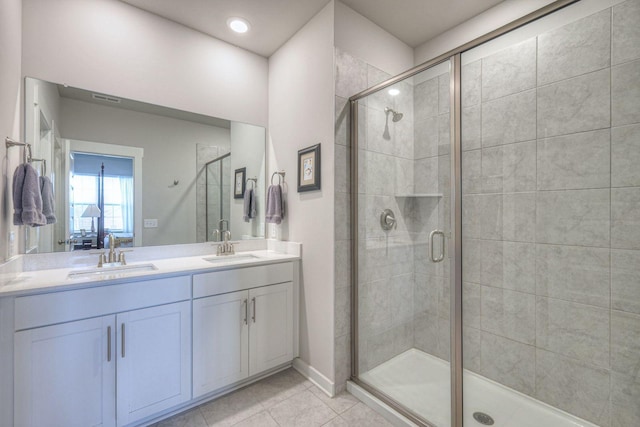 full bathroom featuring a stall shower and a sink