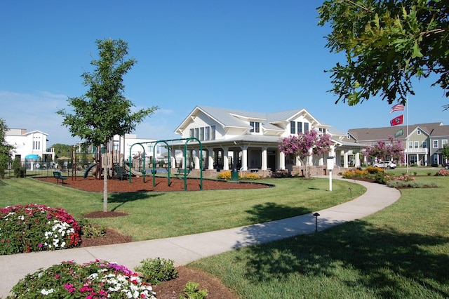 exterior space with playground community and a yard