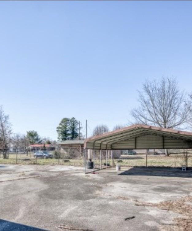 view of front of house with a detached carport